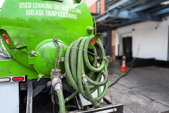 a grease trap pumping service in action at a commercial building in Lehighton